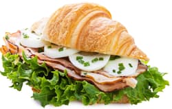 Pappudia Butter croissant with egg, english bacon and chives