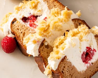 Loaf filled with cream and raspberries