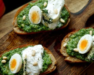 Toast with young nettle pesto, burrata, and quail egg