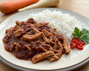 Pulled turkey meat from a slow cooker