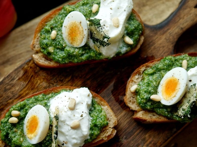 Toast with young nettle pesto, burrata, and quail egg