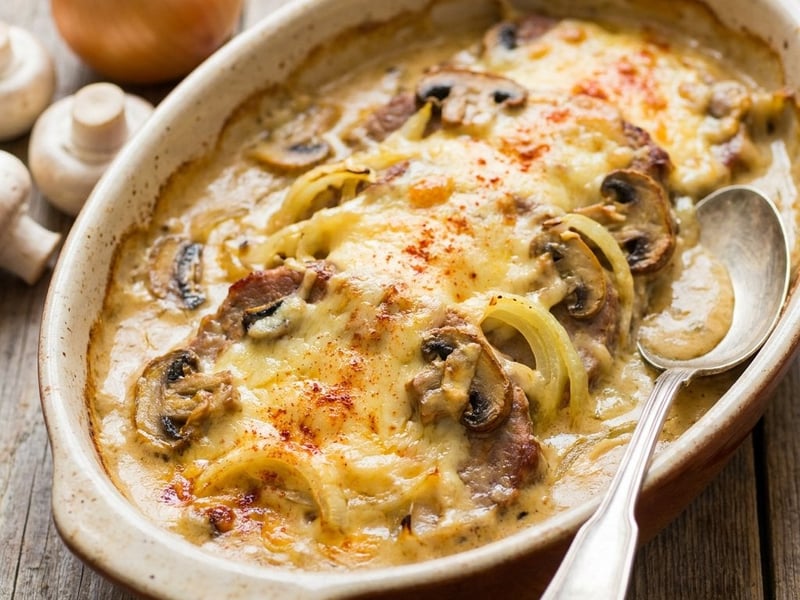 Baked pork neck with cheese and cream