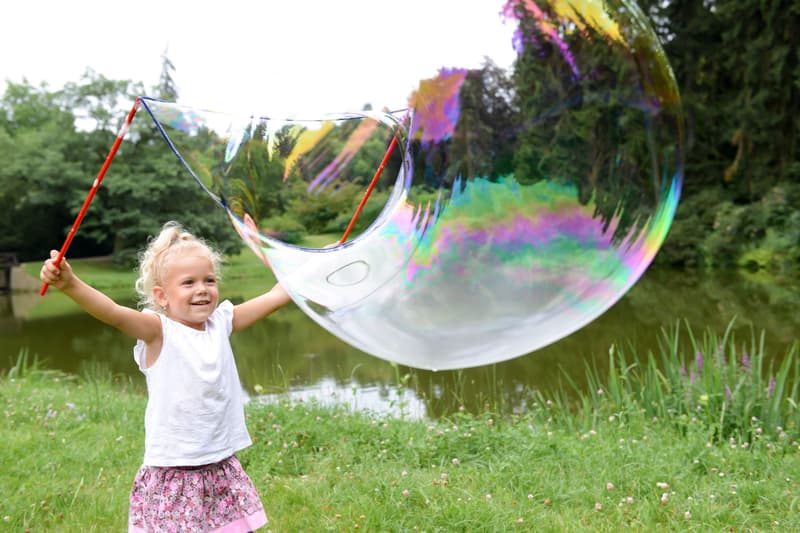 Bubble blower on a giant bubble