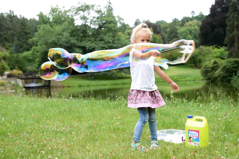 Bubble blower on a giant bubble