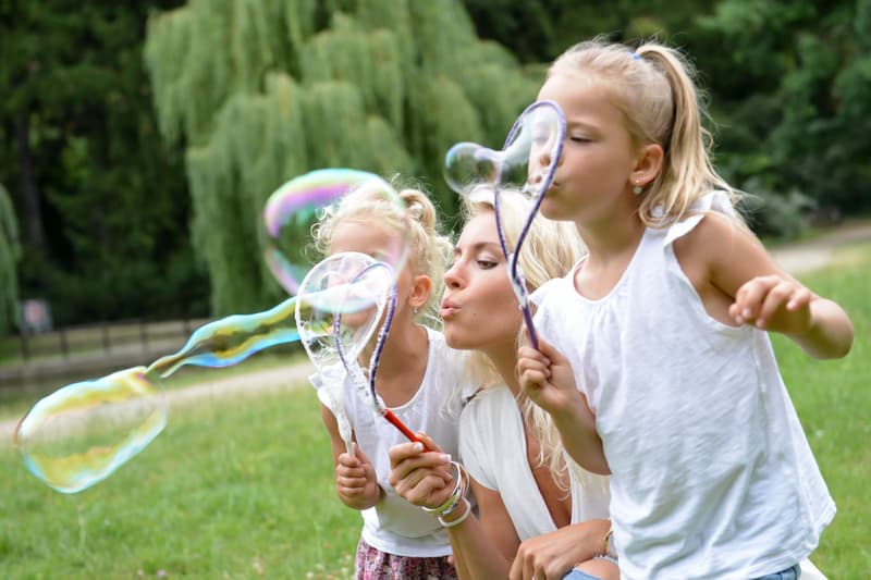 Bubble blower on a giant bubble