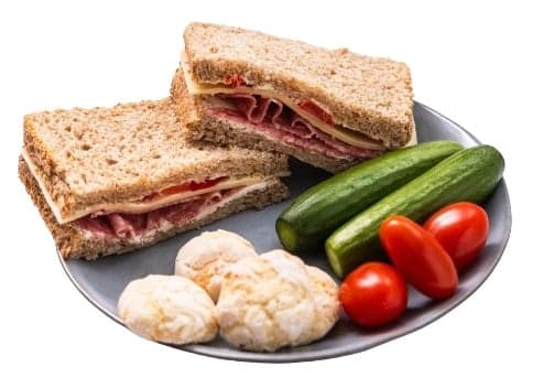 Snack with salami, cheese, biscuits and vegetables