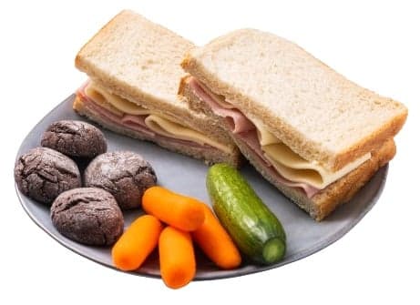 Snack with pork ham, cheese, biscuits and vegetables