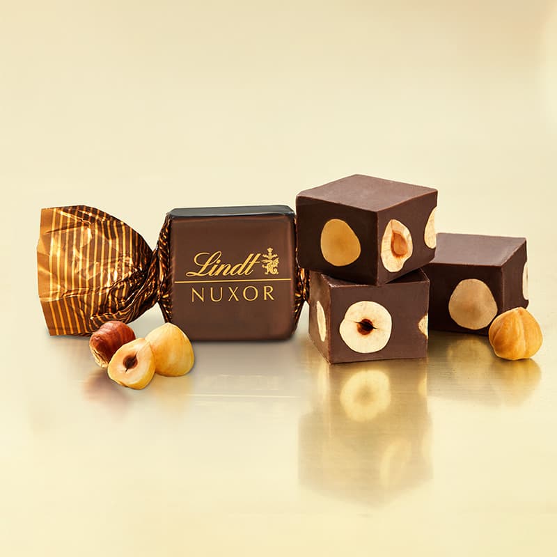 Lindt Bonboniéra Nuxor pralinky hořká čokoláda s celými lískovými ořechy