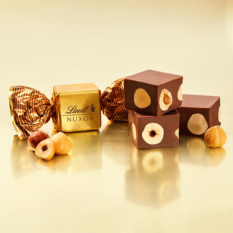 Lindt Bonboniéra Nuxor pralinky mléčná čokoláda s celými lískovými ořechy