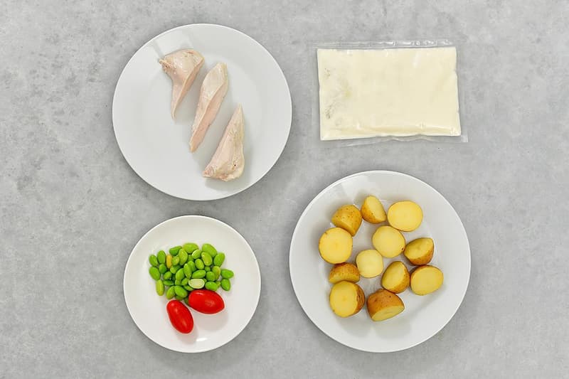 Chicken breast with cheese sauce and mini potatoes